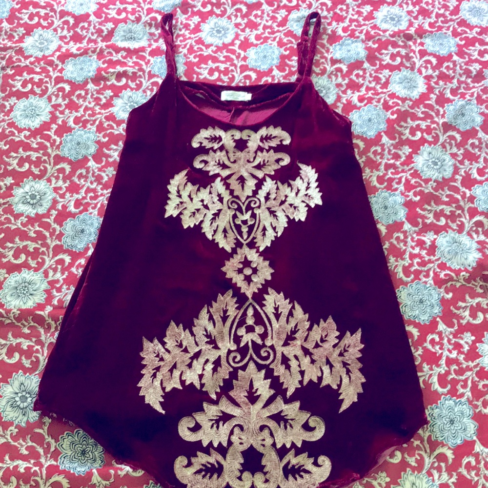 Red velvet dress or long tank blouse.